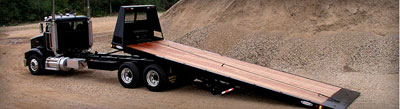 truck with rollback trailer